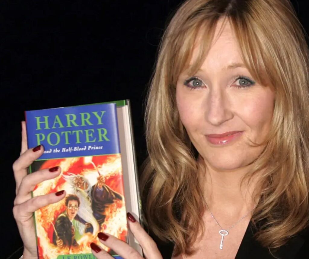 J.K. Rowling in a file photo taken on July 15, 2005. Rowling at Edinburgh Castle, Scotland, holding a copy of her book "Harry Potter and the Half-Blood Prince." —A failure story from rejection to Harry Potter fame